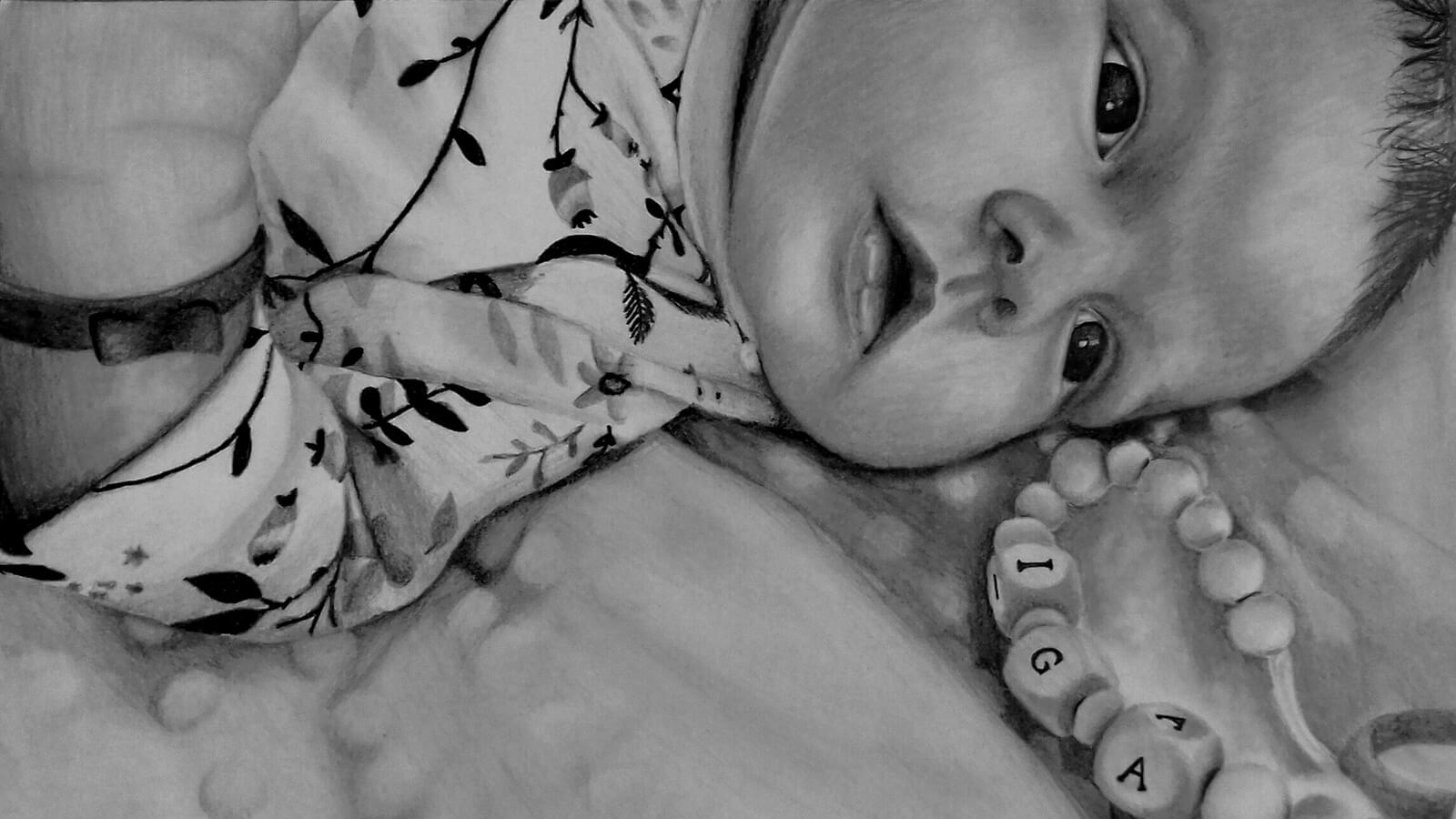 portret na zamowienie idealny prezent na kazda okazje a drawing of a baby lying on a blanket